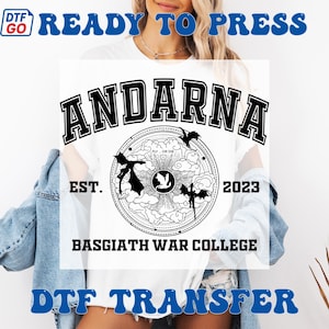 May include: White t-shirt with a black graphic design featuring the word "ANDARNA" above a circular emblem with dragons and the text "BASGIATH WAR COLLEGE EST. 2023". The words "READY TO PRESS" and "DTF TRANSFER" are also visible.