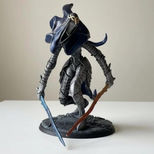 May include: A set of three ceramic mugs with a speckled, matte finish. The mugs are in shades of cream, light gray, and dark gray. Each mug has a simple, minimalist design, perfect for coffee or tea.