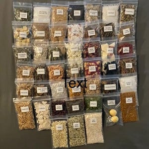 May include: Variety packs of hermit crab cuisine ingredients in clear plastic bags. The bags are labeled with the names of the ingredients, such as "Salmon", "Spinach", and "Oat Bran". The text "Custom Hermit Crab Cuisine" and "Variety Packs" are also visible.