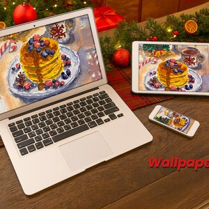 May include: A laptop, tablet, and smartphone display a watercolor image of pancakes with berries and syrup. The devices are on a wooden surface, with Christmas decorations in the background. The text "Wallpaper set" is visible.
