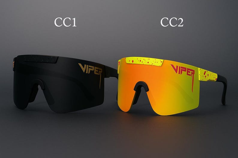 Puede incluir: Se muestran dos pares de gafas de sol Viper. Un par es negro con letras doradas, y el otro es amarillo y naranja con letras doradas. Las gafas de sol tienen un dise&ntilde;o deportivo envolvente, adecuado para actividades al aire libre.