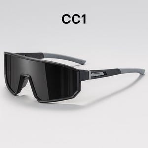 May include: Black sport sunglasses with a wraparound design. The sunglasses have a thick, black frame with gray temples. The text "CC1" is printed in black at the top of the image. The lenses are dark, providing full coverage.
