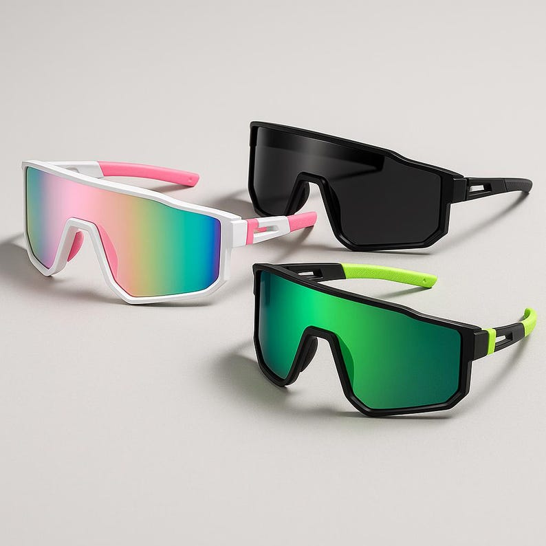 May include: Three pairs of sport sunglasses with a modern design. One pair has a white frame with pink accents and rainbow lenses. Another pair has a black frame with black lenses. The third pair has a black frame with green lenses and neon green accents.
