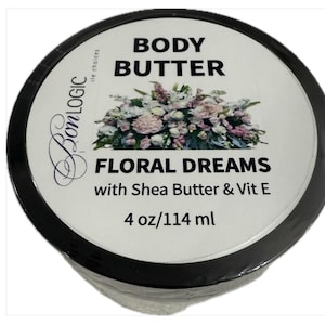 May include: A round container of Bon Logic body butter. The label reads "BODY BUTTER FLORAL DREAMS with Shea Butter & Vit E." The container is black with a white label and a floral design. It contains 4 oz/114 ml.