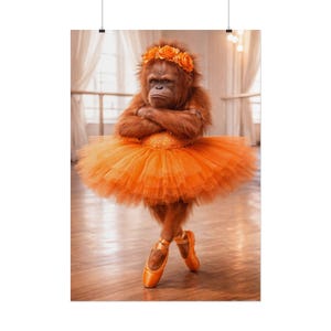 May include: A whimsical poster featuring an orangutan dressed in a bright orange tutu and ballet shoes. The primate wears a floral headband and has its arms crossed. The background suggests a dance studio.