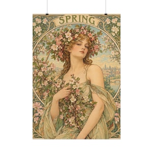 以下が含まれることがあります： SPRINGというタイトルの装飾的なアートプリント。ピンクと白の花の冠をかぶり、長くウェーブのかかった髪をした人物が描かれています。その人物は淡い緑色の流れるような衣服をまとい、花が咲いた枝を手に持っています。