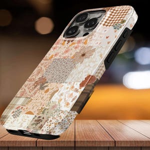 May include: A smartphone case featuring a patchwork design of various patterns including brown and white gingham, floral motifs, small hearts, and abstract shapes in shades of beige, cream, tan, and brown with a black frame and camera cutout.