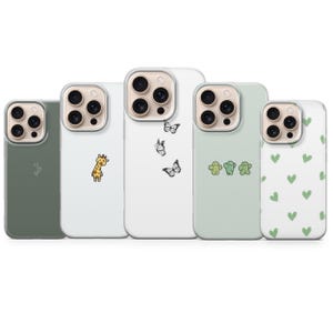 May include: Five phone cases in green and white. Designs include a giraffe, butterflies, green hearts, cactus shapes, and triangles. The cases are for a mobile phone. The cases are in various shades of green and white.