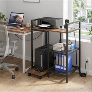 May include: A set of three ceramic mugs with a speckled, cream-colored glaze. Each mug features a different hand-painted design: a blue and green leaf, a yellow flower, and a red berry. The mugs have a simple, rounded shape.