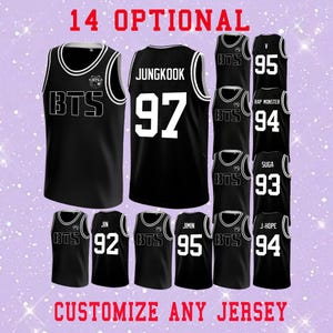 May include: Black basketball jerseys with white accents and text. One jersey has "JUNGKOOK 97" on the back. Other jerseys display names and numbers like "V 95", "RAP MONSTER 94", and "SUGA 93". The text "14 OPTIONAL" and "CUSTOMIZE ANY JERSEY" are also visible.