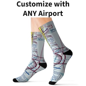 May include: Crew socks featuring a light blue and white aviation chart print with black heels and toes. The socks display detailed aeronautical navigation data, including airport names like Delray Beach and Boca Raton, with the text Customize with ANY Airport.