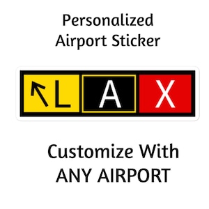 May include: A rectangular sticker featuring the text Personalized Airport Sticker above and Customize With ANY AIRPORT below. The center graphic is a horizontal sign with three sections: yellow with an arrow and L, black with A, and red with X.
