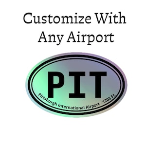 May include: An oval sticker with a holographic finish featuring the black text PIT in the centre. Below the text, it reads Pittsburgh International Airport 1203 Ft. Above the oval, the text reads Customize With Any Airport in black font.