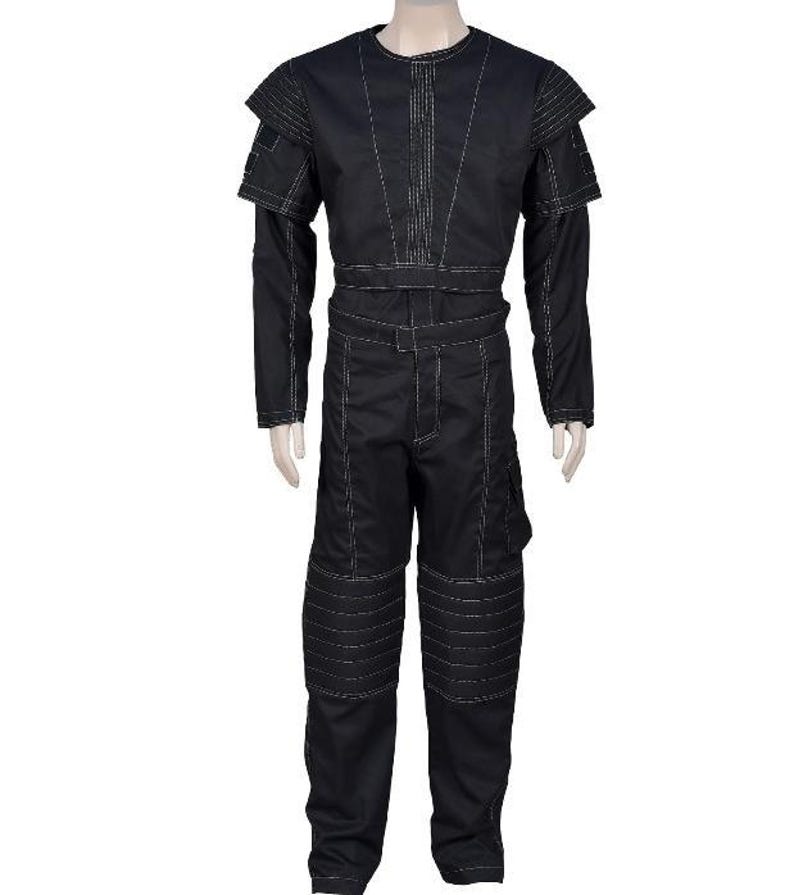 May include: Black jumpsuit with white stitching details. The outfit features a round neck, long sleeves, and padded shoulder accents. The pants have reinforced knee panels and a cargo pocket. The jumpsuit is displayed on a mannequin.