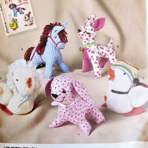 May include: A vintage Simplicity sewing pattern for making five stuffed animal toys. The pattern includes a horse, a deer, a chick, a dog, and a goose. The pattern is for one size and is from the Simplicity Archives.