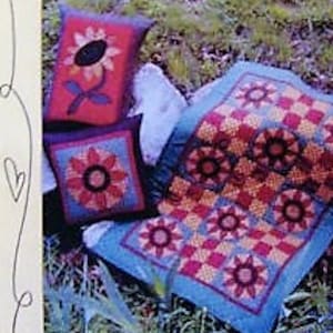 May include: A crochet quilt pattern featuring a sunflower design. The pattern is called "Our Garden Grows #125" and is from the company "Bloomin' Minds".