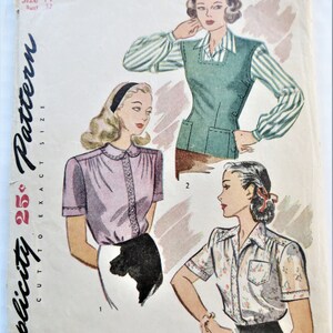 May include: Vintage Simplicity sewing pattern number 1089 for a blouse with short sleeves. The pattern is for size 14 and is cut to exact size. The pattern shows three different styles of blouses, one with a striped shirt underneath a green vest, one with a pink blouse, and one with a white blouse with a floral print.