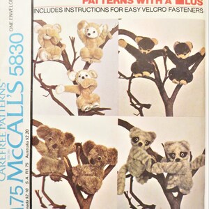 May include: A sewing pattern for making stuffed animals. The pattern includes instructions for using Velcro fasteners. The pattern shows five different animals: a monkey, a koala, and three lemurs.