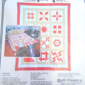 May include: A printed pattern for a sampler quilt, featuring a red and white design. The quilt measures 90" x 108" (2.29m x 2.75m). The pattern includes instructions for teachers and students, with 12 different patterns. The text "Beginning Sampler Quilt" is at the top.