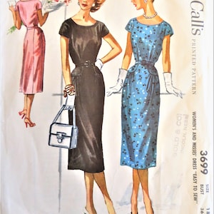 May include: Vintage McCall's sewing pattern for a women's dress, size 18, bust 36. The pattern is for a dress that is easy to sew and is printed on a white background with a blue and white floral design. The pattern is labelled "Easy to Sew" and "McCall's Printed Pattern".