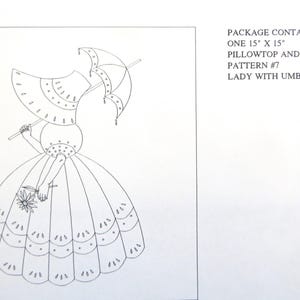 May include: A black and white line drawing of a lady holding an umbrella and a flower. The lady is wearing a large dress and a hat. The text on the image reads: "PACKAGE CONTAINS: ONE 15" X 15" PILLOWTOP AND BACK PATTERN #7 LADY WITH UMBRELLA."