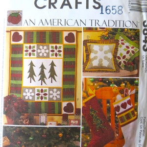 May include: McCall's Crafts pattern number 1658 for an American Tradition quilt, pillow, and stocking. The quilt features a red, green, and white patchwork design with a snowflake, pine tree, and heart motifs. The pillow is white with a snowflake design and a red, green, and white border. The stocking is red with a green and white trim and a pine tree design.