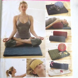 May include: A Simplicity yoga accessories pattern. The image shows a woman meditating on a blue mat, and various yoga accessories, including bolsters, eye pillows, and mats. The text "yoga accessories" is visible.