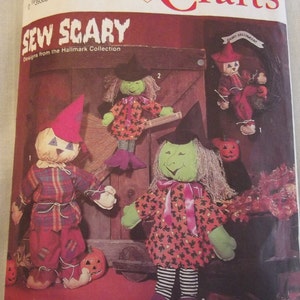 May include: Sew Scary Halloween craft pattern featuring three different characters: a witch, a scarecrow, and a jack-o-lantern. The pattern is from the Hallmark Collection.