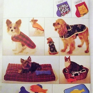 May include: A sewing pattern for making pet clothes and accessories. The pattern includes instructions for making a dog coat, a cat bed, and a dog bed. The pattern also includes instructions for making a dog bone toy and a fish-shaped toy. The pattern is from Butterick and the pattern number is 4226.