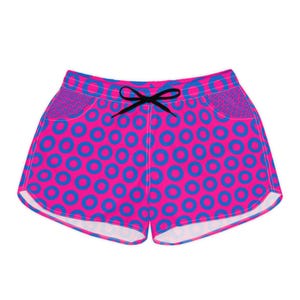 May include: Vibrant pink shorts with a blue circle pattern and a black drawstring. The shorts have a bold design of blue circles on a pink background. The pockets feature a smaller, darker blue pattern.