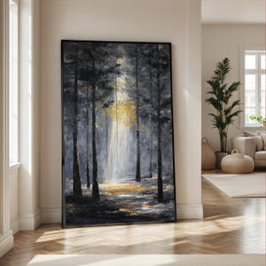 May include: Large framed artwork depicting a forest scene. The painting features tall, dark trees with a bright, golden light shining through the center. The color palette includes shades of gray, black, and yellow.