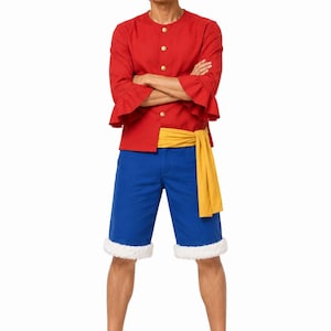 May include: A costume consisting of a straw hat with a red ribbon, a red button-down shirt with ruffled three-quarter sleeves, a yellow sash, blue shorts with white faux fur trim at the hems, and black thong sandals worn on the feet.