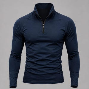 May include: A long-sleeve pullover shirt in a solid dark navy blue colour. The garment features a high collar with a central metal zip closure that extends down to the chest. The sleeves are designed with raglan seams and a fitted silhouette.