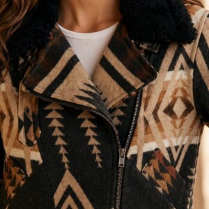 Detailed view of the Southwestern Aztec print on the genuine sheep leather Dutton Ranch Season 1 Kelly Reilly Jacket.