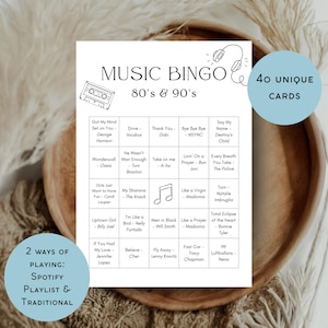 May include: A white Music Bingo game card with the text "Music Bingo 80's & 90's" and song titles. Includes 40 unique cards and 2 ways of playing: Spotify playlist & traditional. The card is on a wooden tray.