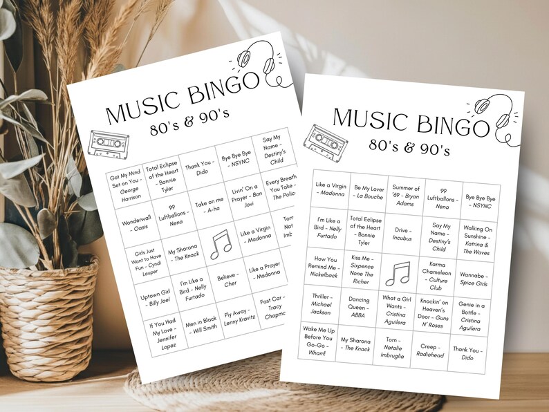 May include: Two white Music Bingo game sheets featuring 80s & 90s music hits. The top of each sheet has the words "Music Bingo" and "80's & 90's" with a cassette tape and headphone graphic. Each sheet has a grid of song titles.