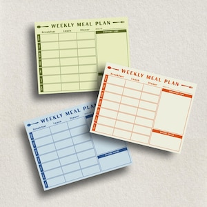 May include: Three colorful weekly meal plan notepads. Each notepad features a layout for breakfast, lunch, and dinner, with space for a grocery list and snack ideas. The notepads are in shades of yellow, orange, and blue.