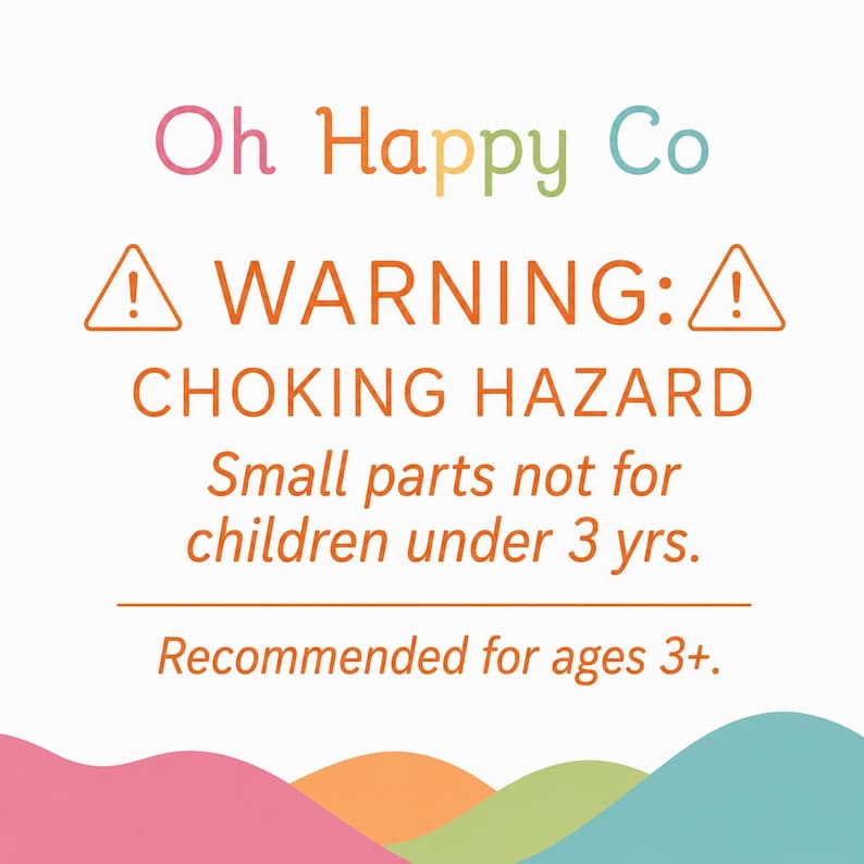 May include: A white safety warning sign with the text Oh Happy Co at the top. Below, orange warning triangles flank the text WARNING: CHOKING HAZARD. It states Small parts not for children under 3 yrs. and Recommended for ages 3+ with wavy color shapes.