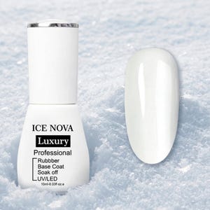 May include: A white ICE NOVA Luxury professional rubber base coat nail polish bottle and a painted nail sample. The bottle has a silver cap and black text. The nail polish is 10ml - 0.33 fl oz.