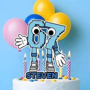 May include: A white frosted birthday cake with colorful sprinkles, topped with a blue number 67 character with arms and legs, and the name "STEVEN". The cake is decorated with lit candles and surrounded by balloons.