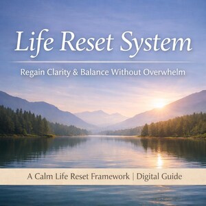 May include: A serene landscape featuring a lake surrounded by mountains and trees under a blue sky. The text "Life Reset System" is displayed above the words "Regain Clarity & Balance Without Overwhelm". The phrase "A Calm Life Reset Framework | Digital Guide" is at the bottom.