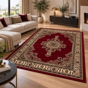 Könnte beinhalten: Ein rechteckiger Teppich mit einem tiefroten Feld und einem zentralen, verzierten Medaillonmuster in Creme und Schwarz. Der Teppich ist von einer breiten, kunstvollen Bordüre mit floralen und geometrischen Motiven in Creme, Schwarz und Dunkelrot umrahmt.