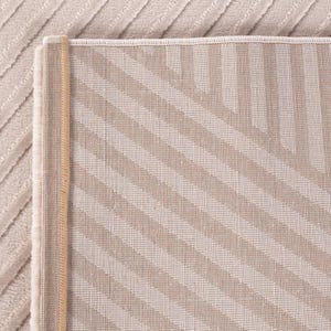 May include: Beige and tan area rug with a striped pattern. The rug has a textured surface and a contrasting border. The stripes run diagonally across the rug, creating a visual interest. The rug is made of a soft material.