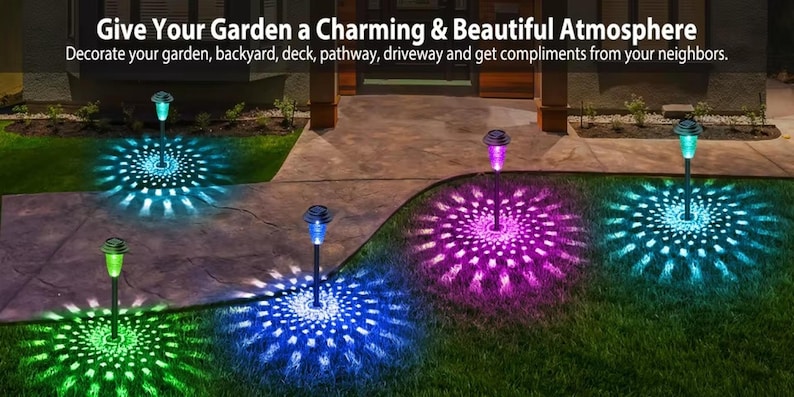 RGB solar lights casting green, blue, and purple burst patterns on a patio and lawn at night