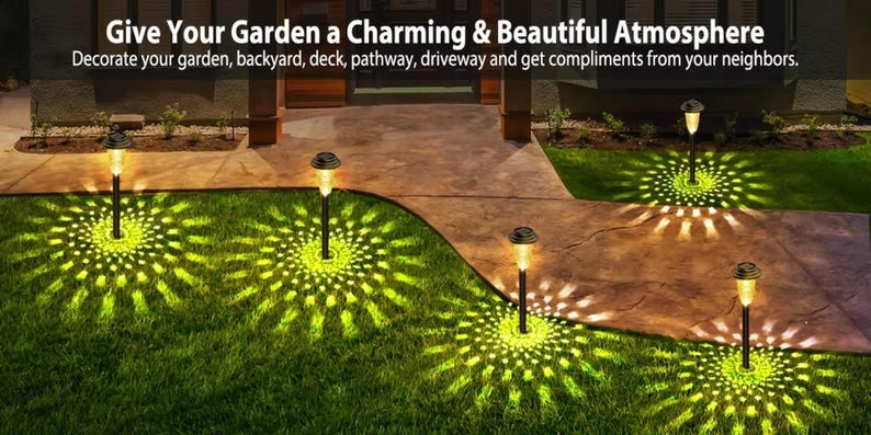 Solar garden lights illuminating a curved driveway and lawn pathway with warm yellow-green glow