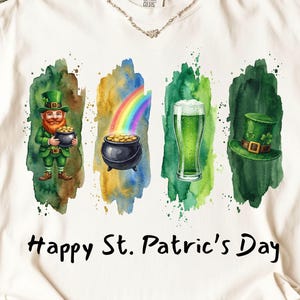 Op de afbeelding: Wit T-shirt met een aquarelontwerp voor St. Patrick's Day. Het ontwerp bevat een kabouter, regenboog, pot met goud, groen bier en een groene hoed. De woorden "Happy St. Patrick's Day" staan eronder.