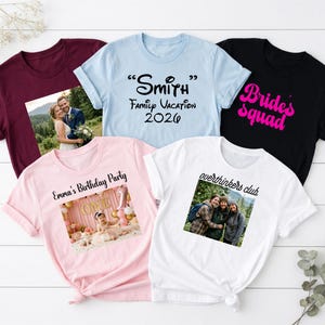 May include: Five short-sleeved t-shirts in maroon, light blue, black, light pink, and white. The maroon shirt features a photo of a couple. The light blue shirt says Smith Family Vacation 2026. The black shirt says Bride's squad. The pink shirt shows a birthday photo with text Emma's Birthday Party. The white shirt shows a group photo with text overthinkers club.