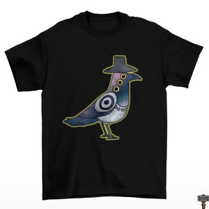 May include: Black t-shirt featuring a cartoon pigeon wearing a hat and a necklace. The pigeon has a blue, purple, and white body with yellow accents. The design is outlined in yellow.