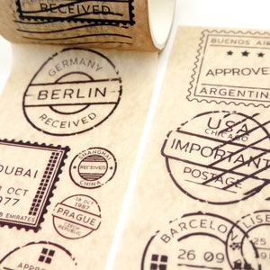 May include: A roll of brown paper tape with various black and white stamps featuring city names and dates. The stamps include "Berlin", "Dubai", "Shanghai", "Prague", "Buenos Aires", "USA Chicago", "Barcelona", and "Lisbon".