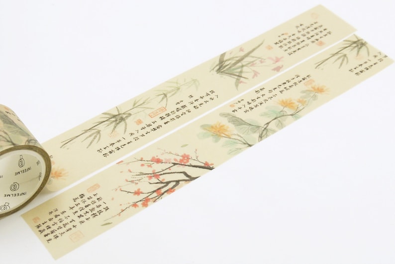 May include: A roll of decorative washi tape with a beige background and a floral design. The tape features delicate illustrations of bamboo, flowers, and Chinese calligraphy. The text on the tape reads: "The wind blows through the bamboo forest, rustling the leaves. The flowers bloom in the spring, filling the air with fragrance."